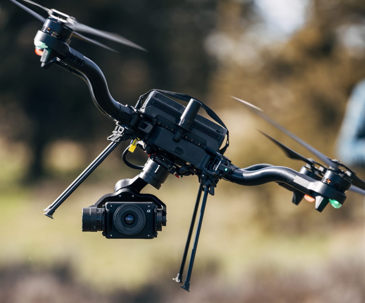 Close view of a banking Astro with its arms, batteries and camera gimbal visible